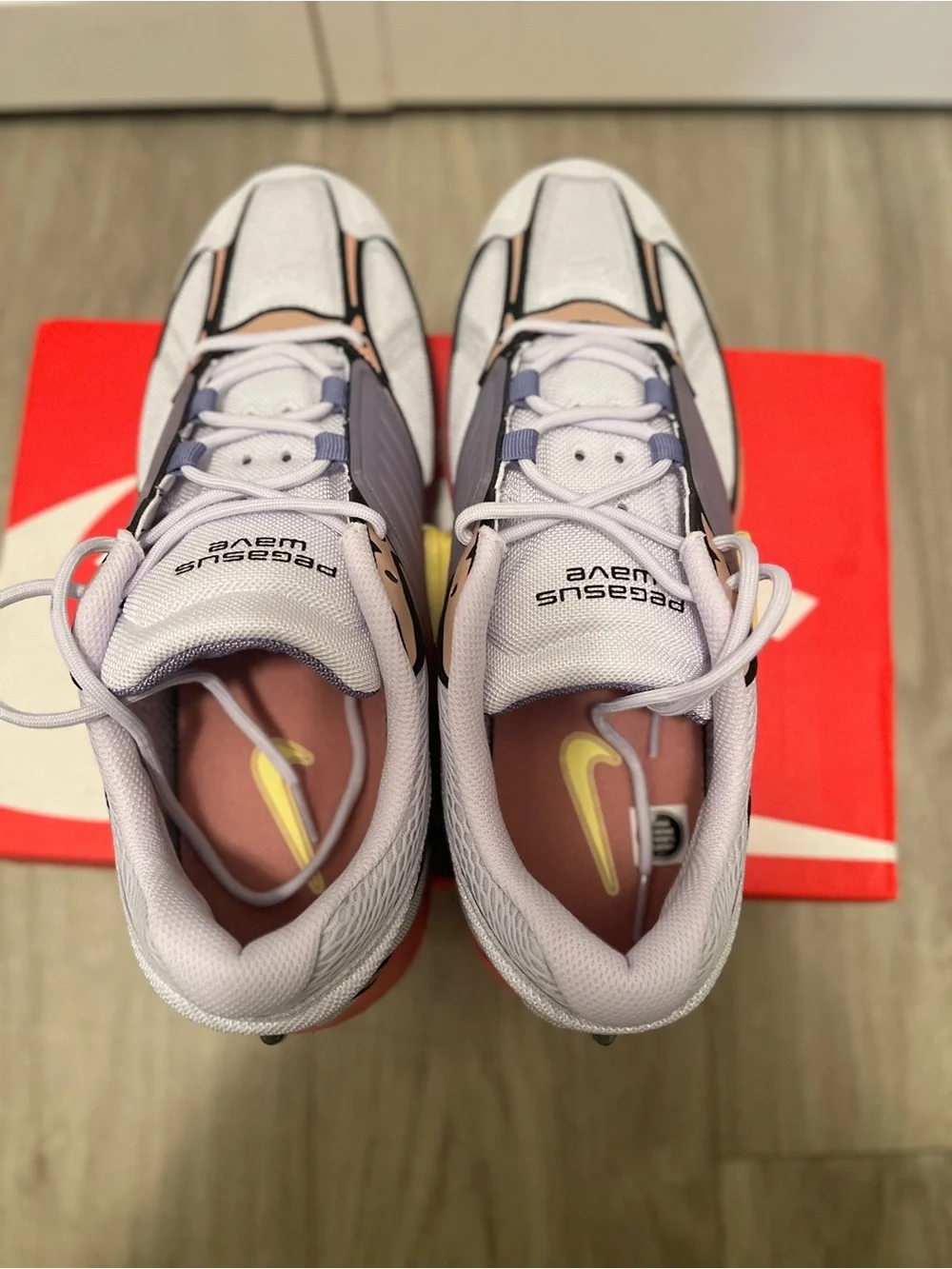 Nike men’s Pink and Gray Sneakers with Yellow Swoosh